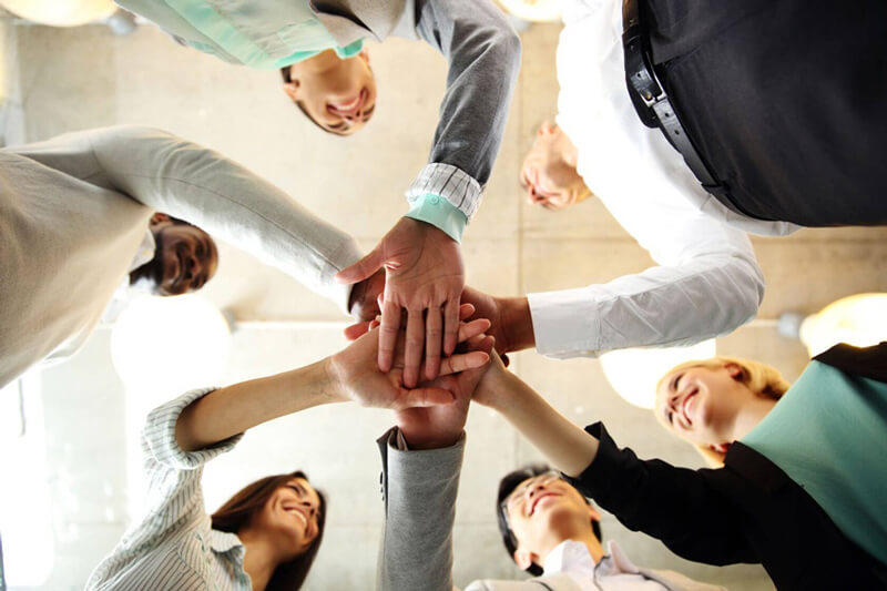 Team crossing hands