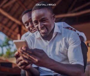 two guys playing mobile games in Africa
