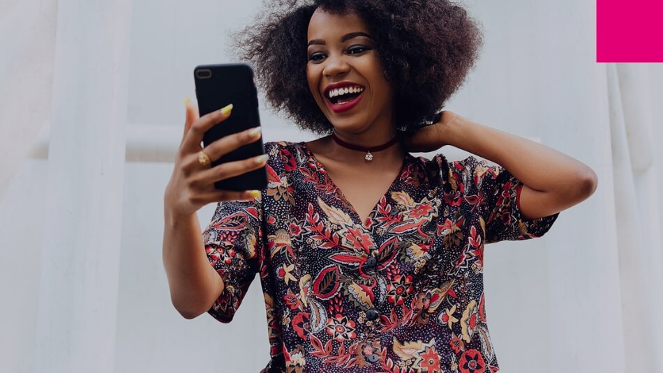 Women in africa takes a selfie with her smartphone