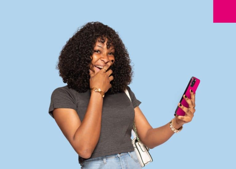 Women using phone to buy online with mobile money