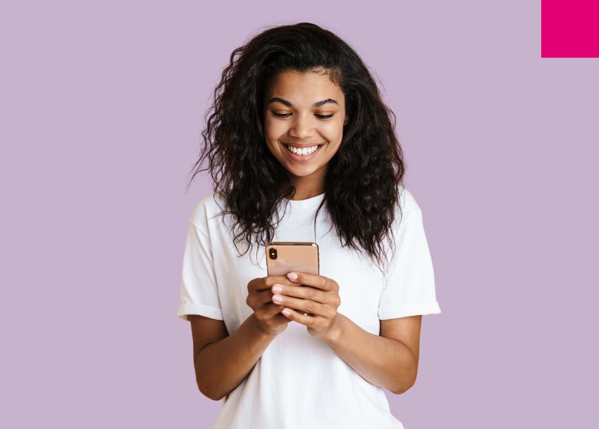 Women using phone to access the mobile money market