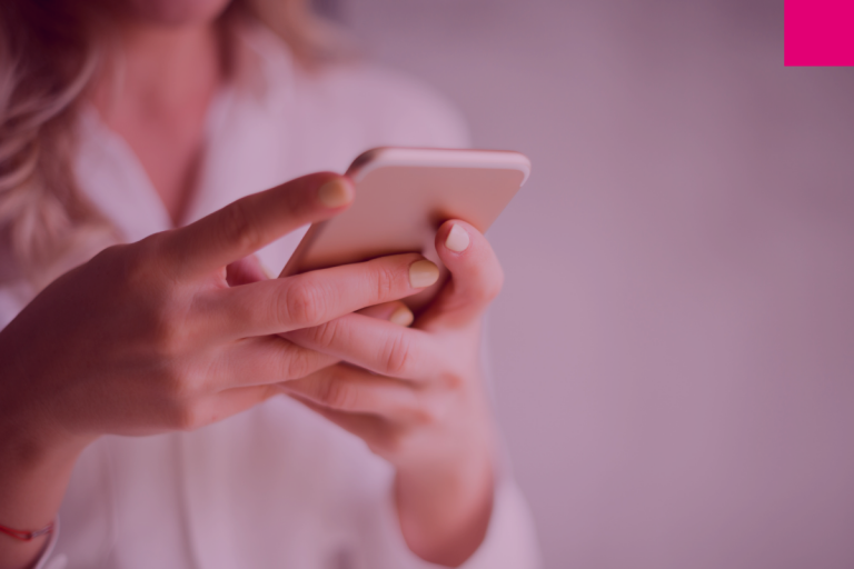 Woman holding a phone to represent digital customer experience